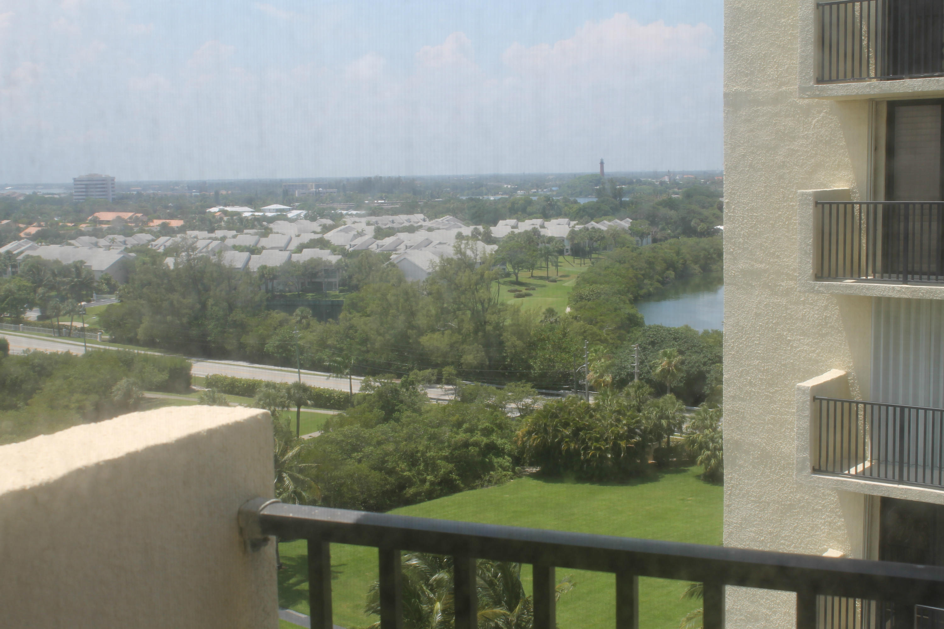 300 Ocean Trail Way, Unit 1010 Jupiter, FL 33477 - Photo 20 of 25 a view of a lake from a balcony