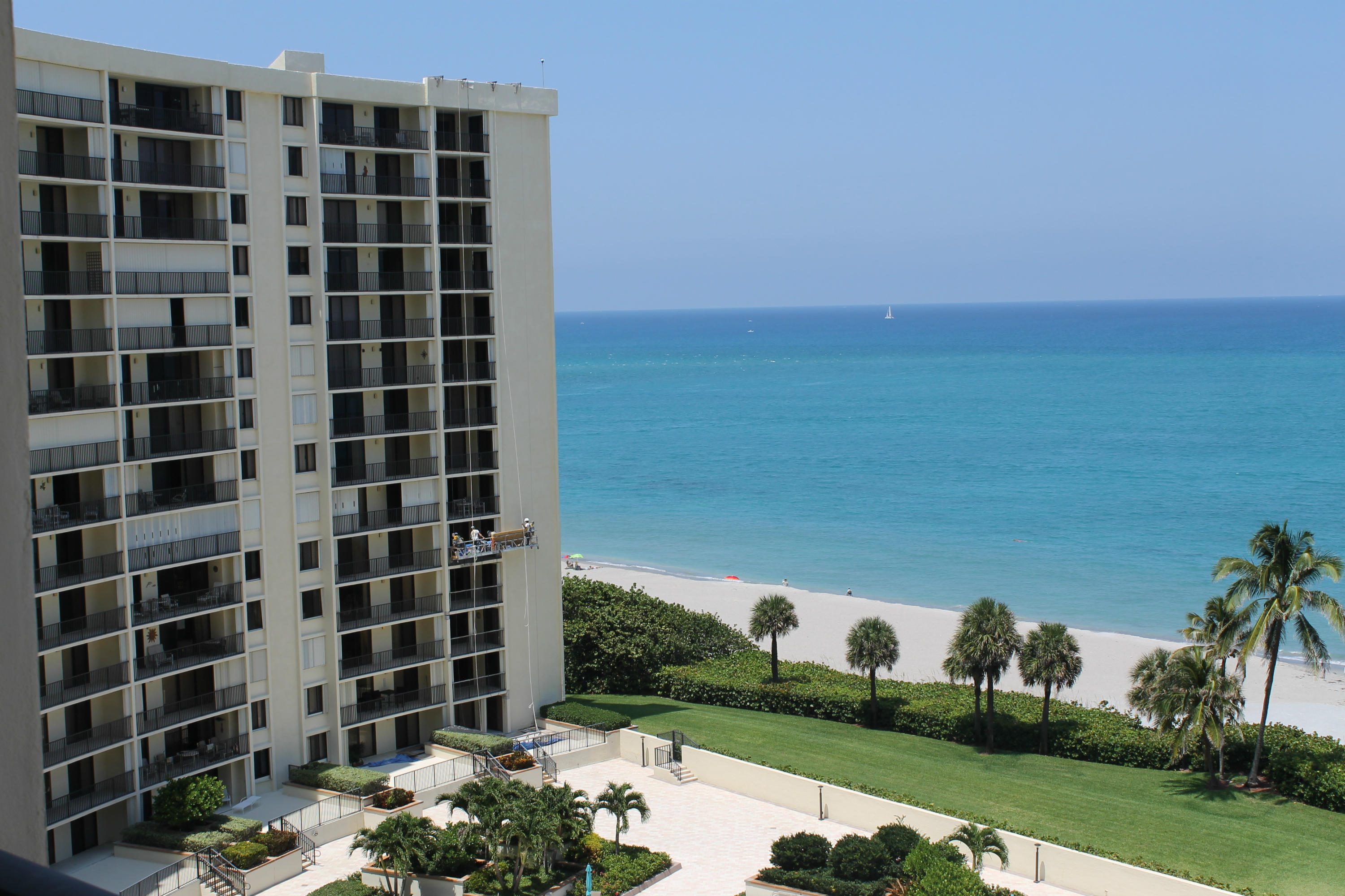 300 Ocean Trail Way, Unit 1010 Jupiter, FL 33477 - Photo 3 of 25 a view of a building with a garden