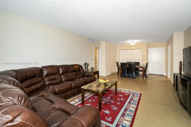 a view of kitchen with furniture and a potted plant