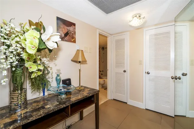 a bedroom with a bed and a table