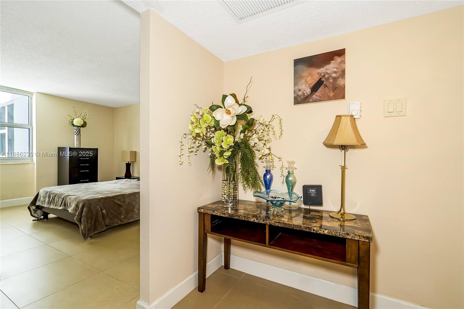 2030 South Ocean Drive, Unit 1118 Hallandale Beach, FL 33009 - Photo 18 of 58 a living room with furniture and a table