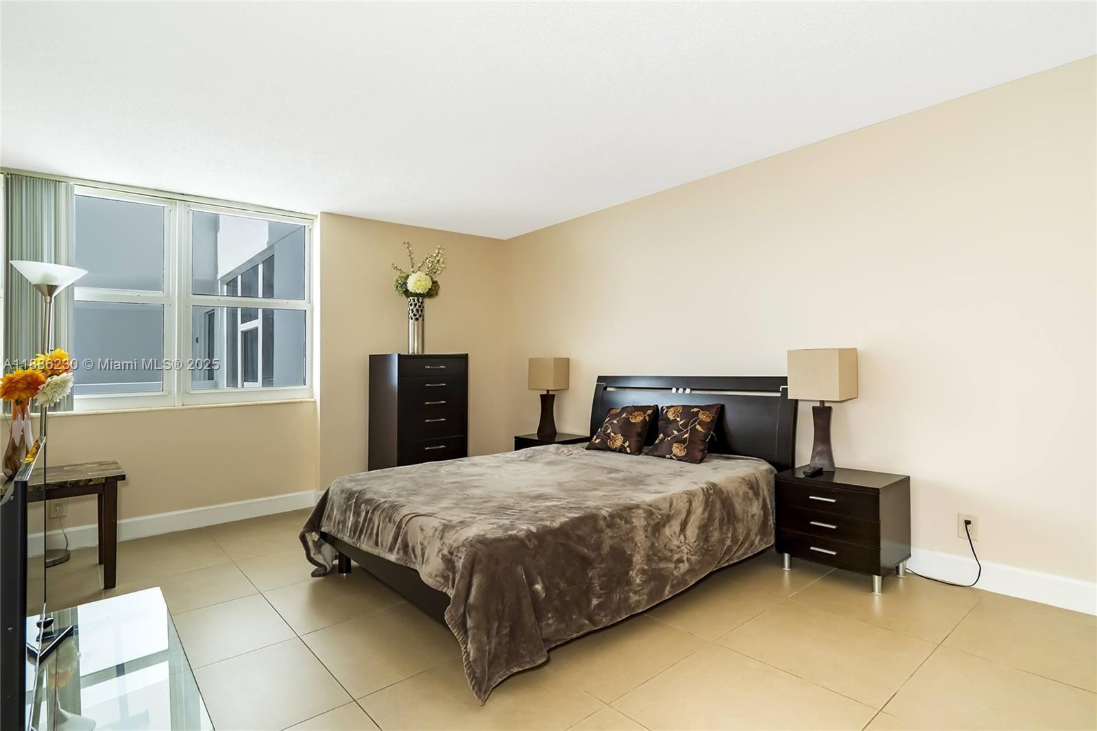 2030 South Ocean Drive, Unit 1118 Hallandale Beach, FL 33009 - Photo 19 of 58 a bedroom with a bed and a table