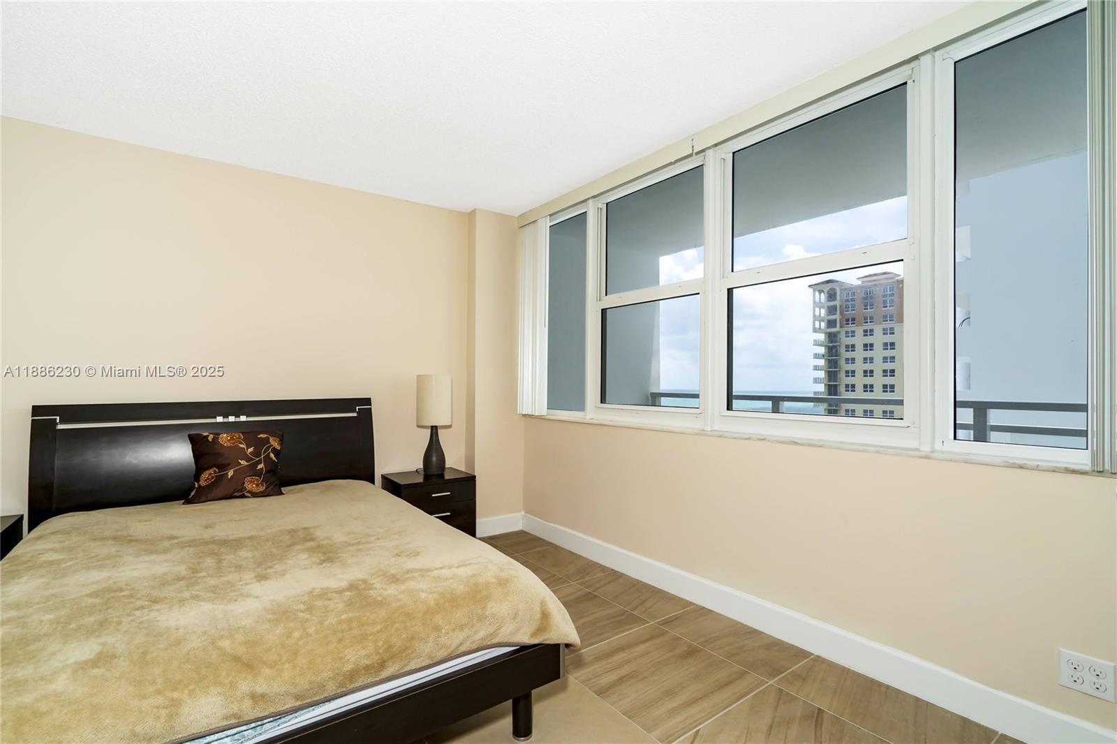 2030 South Ocean Drive, Unit 1118 Hallandale Beach, FL 33009 - Photo 28 of 58 a bedroom with a bed and window