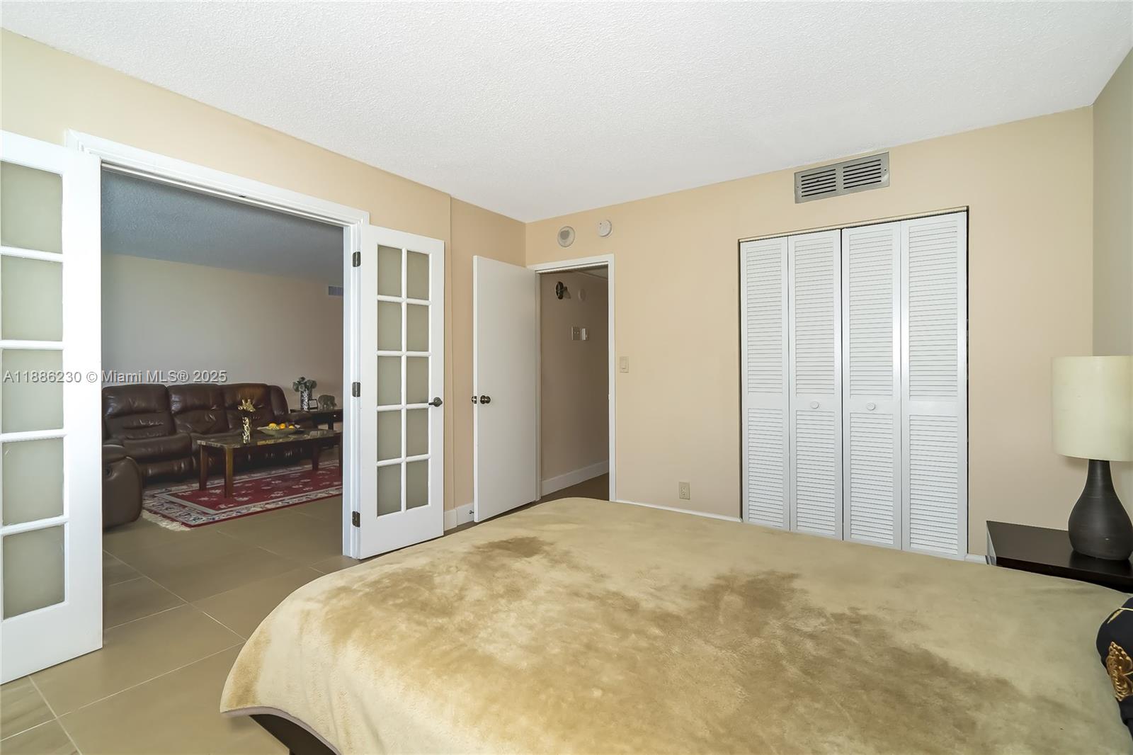 2030 South Ocean Drive, Unit 1118 Hallandale Beach, FL 33009 - Photo 30 of 58 a bedroom with a bed and a view of living room