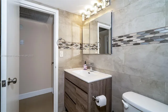 a view of living room with furniture and large window