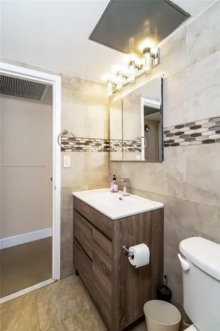 a view of a chairs and table in a patio