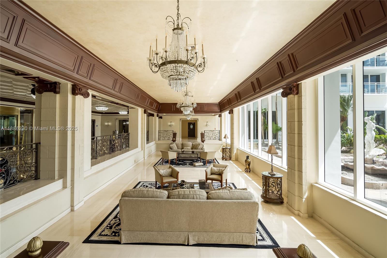 2030 South Ocean Drive, Unit 1118 Hallandale Beach, FL 33009 - Photo 45 of 58 a living room with large window chandelier and dining table