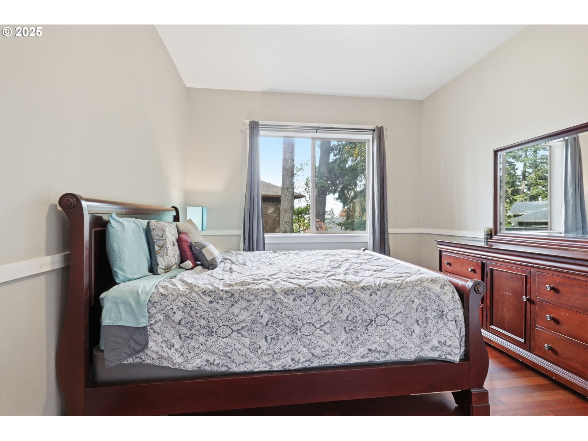 937 Southwest Florence Court Gresham, OR 97080 - Photo 11 of 47 a bed sitting in a bedroom next to a window