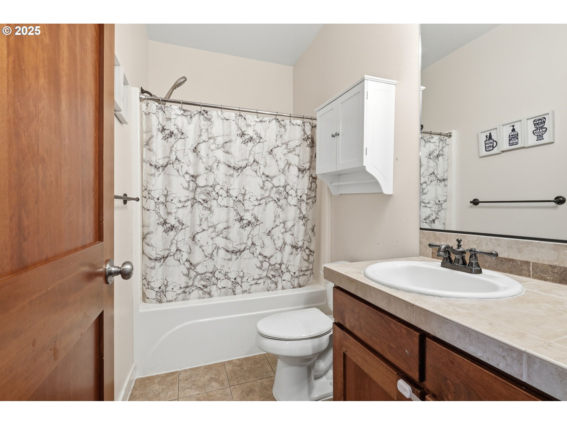 937 Southwest Florence Court Gresham, OR 97080 - Photo 13 of 47 a bathroom with a sink toilet a mirror and shower