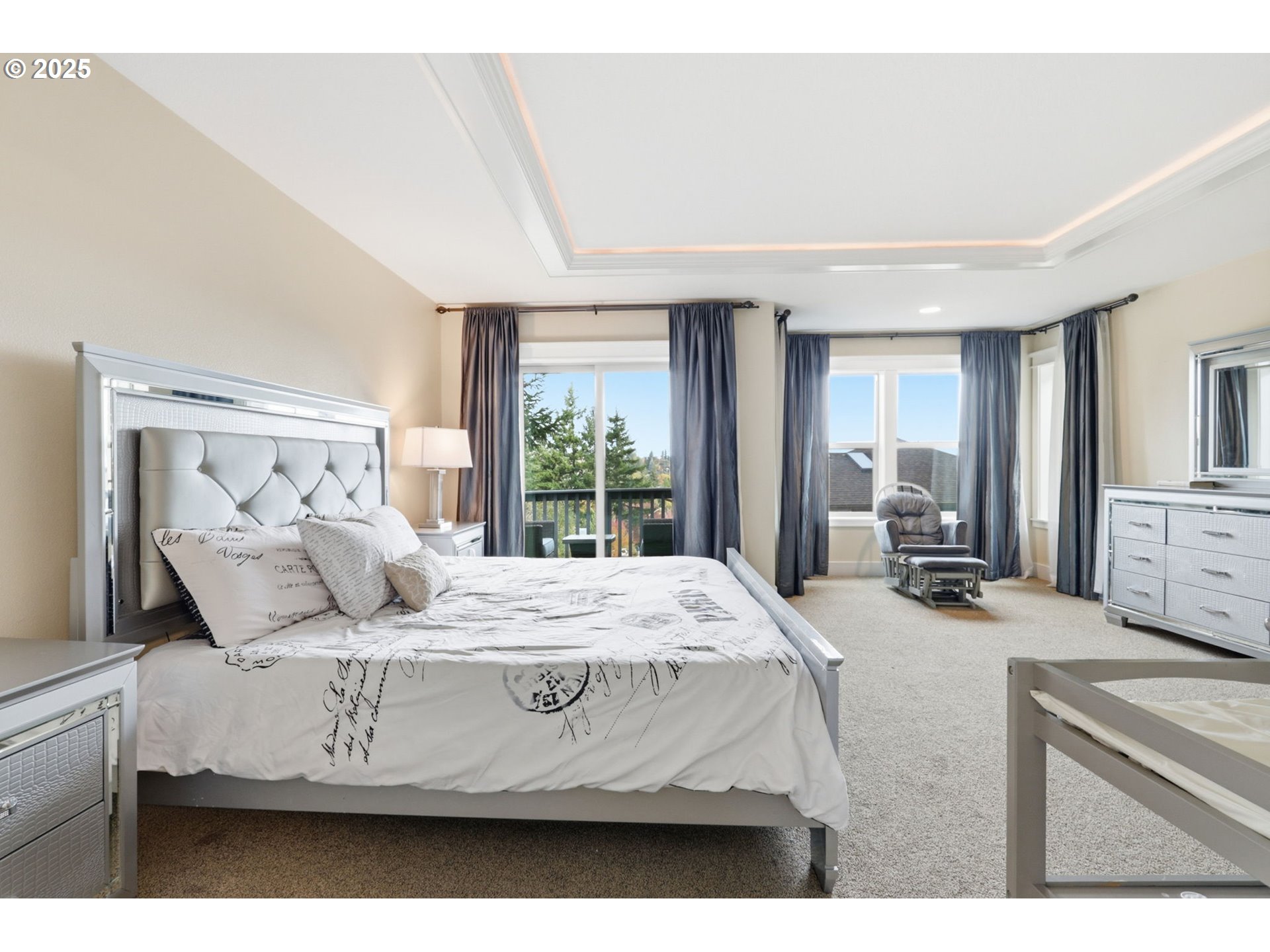 937 Southwest Florence Court Gresham, OR 97080 - Photo 18 of 47 a bedroom with a bed a large window and dresser