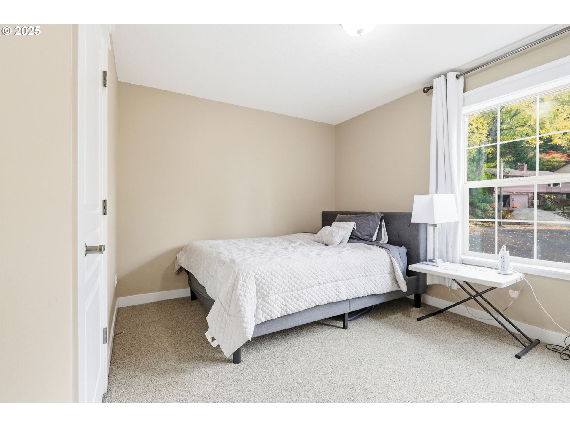 937 Southwest Florence Court Gresham, OR 97080 - Photo 30 of 47 a bedroom with a bed chair and a window