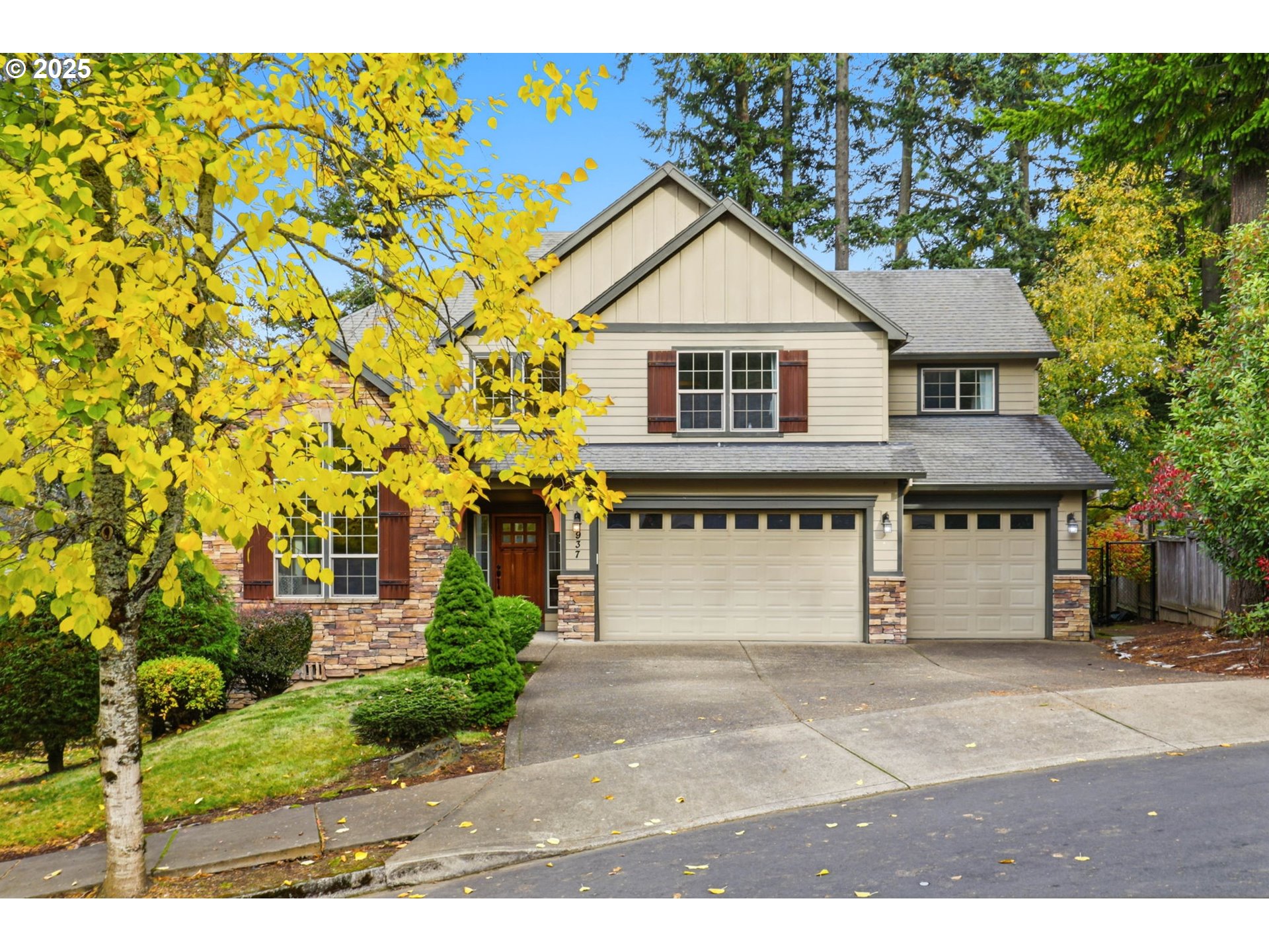 937 Southwest Florence Court Gresham, OR 97080 - Photo 45 of 47 a front view of a house with a yard and garage