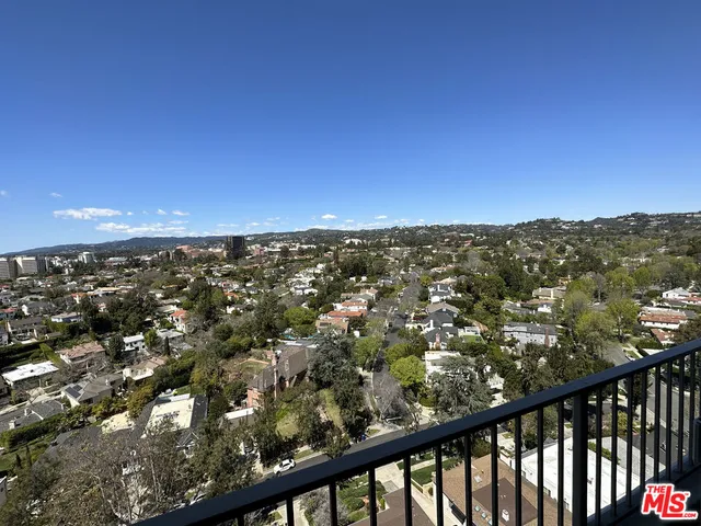 a view of city and green space