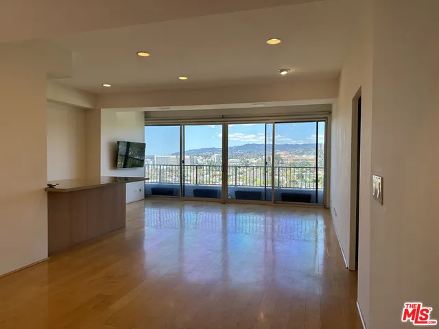 a view of a kitchen with a sink and cabinets