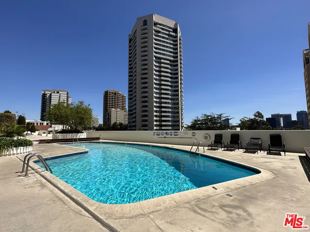 a view of swimming pool with chairs