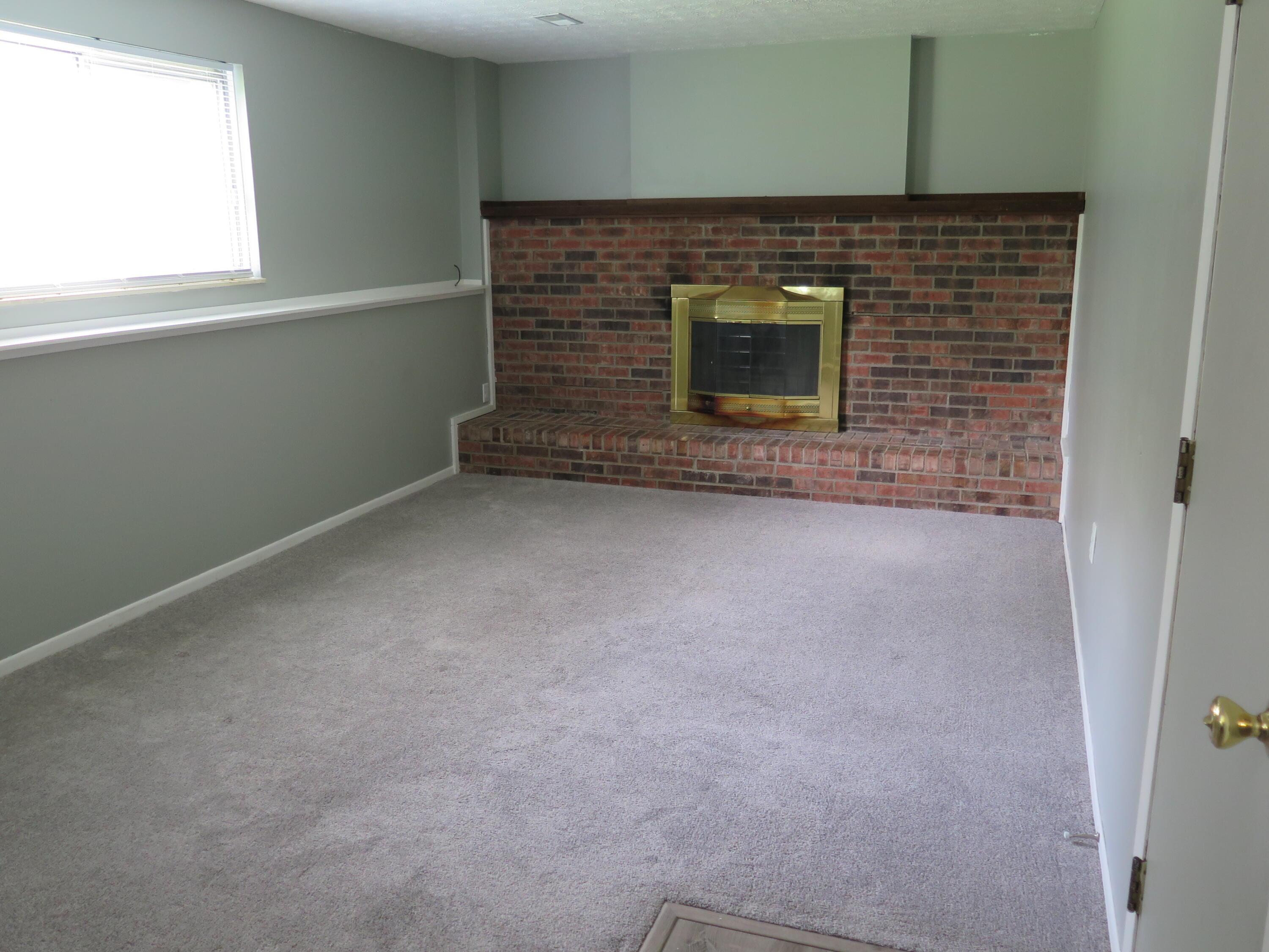 1921 Lost Valley Road Powell, OH 43065 - Photo 16 of 28 FR with full-wall brick hearth