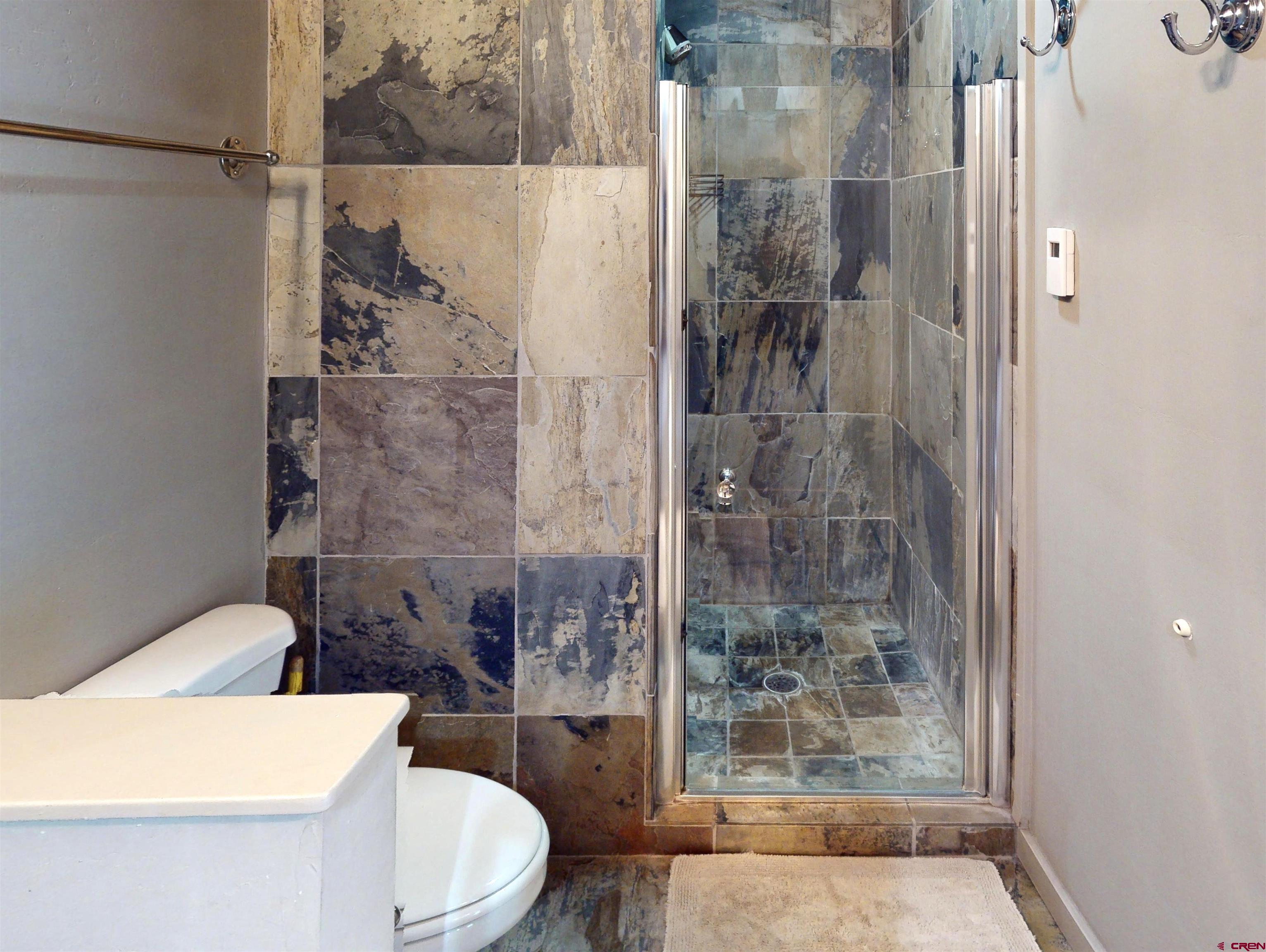 11 Emmons Road, Unit 322 Crested Butte, CO 81225 - Photo 11 of 21 a bathroom with a bathtub and a shower