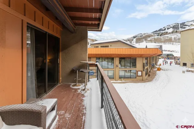 a view of a balcony with a patio