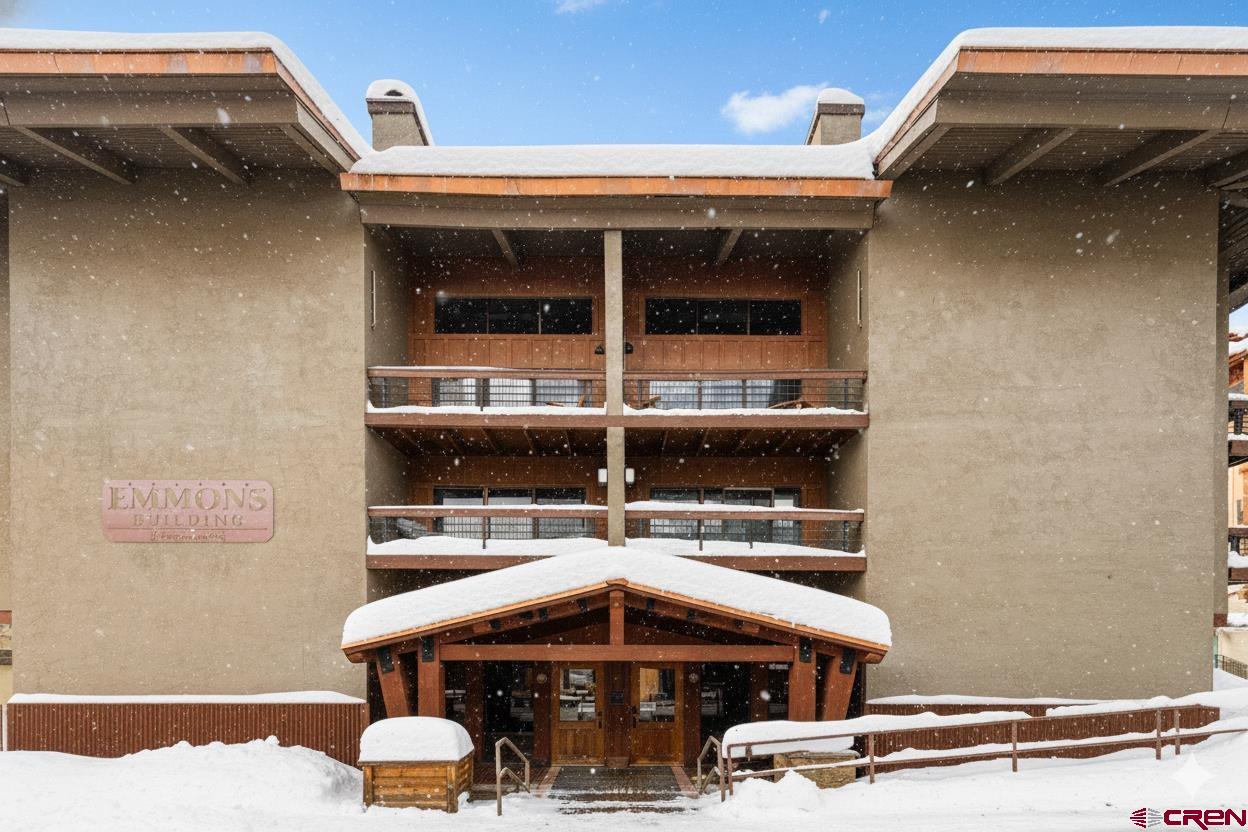 11 Emmons Road, Unit 322 Crested Butte, CO 81225 - Photo 18 of 21 a room with furniture and a table