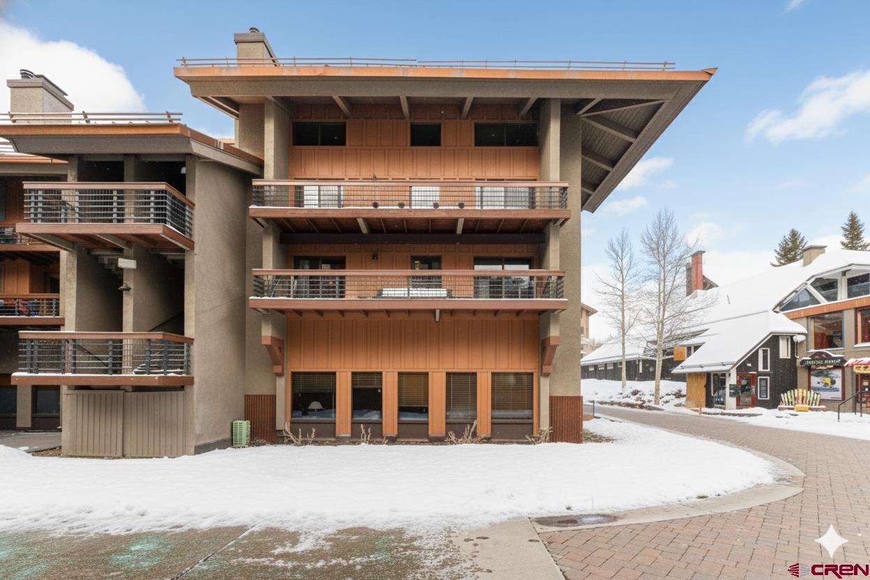 11 Emmons Road, Unit 322 Crested Butte, CO 81225 - Photo 19 of 21 a view of a building with a street