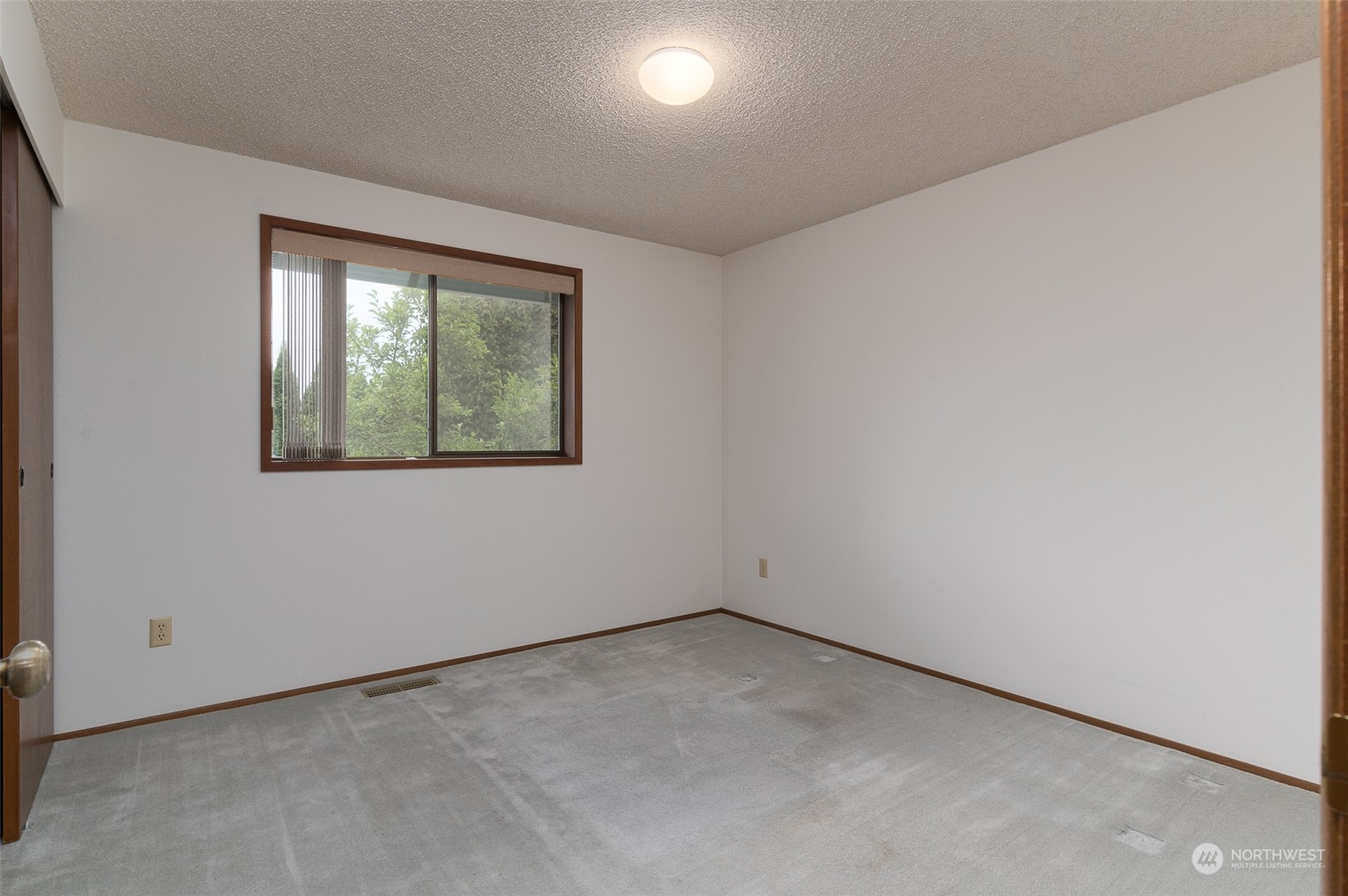 243 Bayside Road Bellingham, WA 98225 - Photo 11 of 22 an empty room with a window