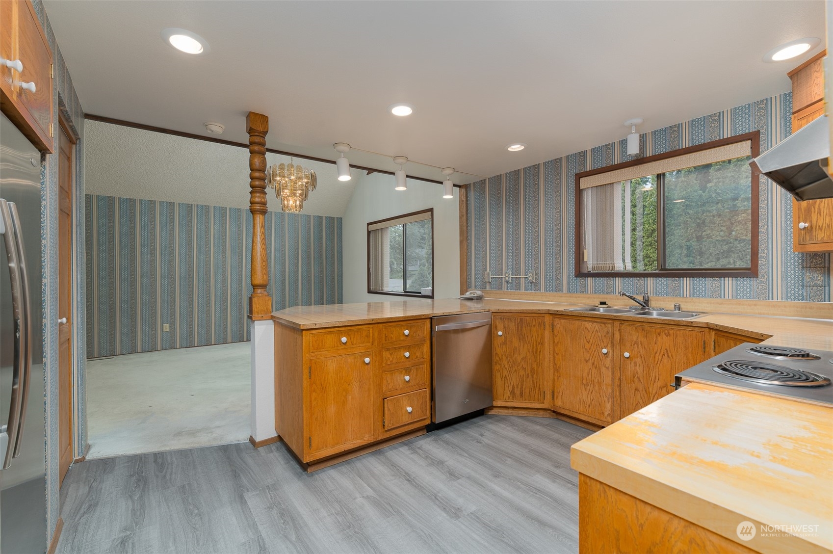 243 Bayside Road Bellingham, WA 98225 - Photo 5 of 22 a large kitchen with wooden floors and a sink