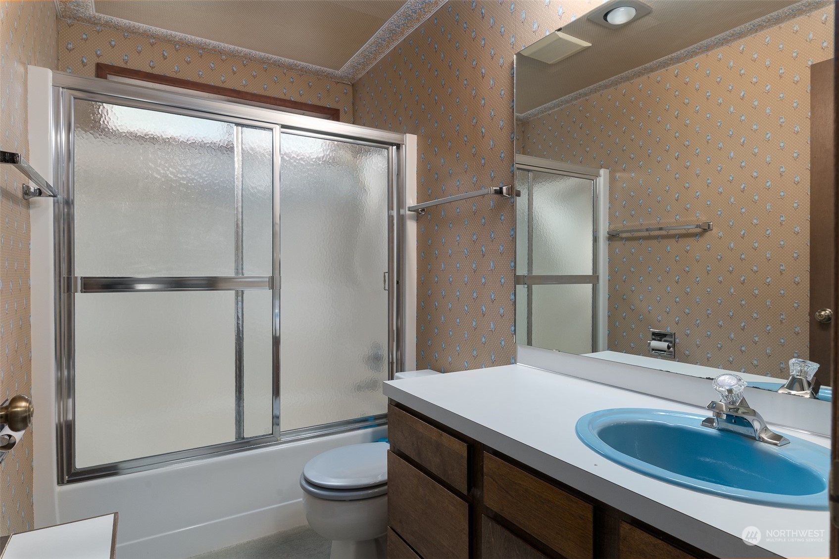 243 Bayside Road Bellingham, WA 98225 - Photo 10 of 22 a bathroom with a granite countertop sink toilet and shower