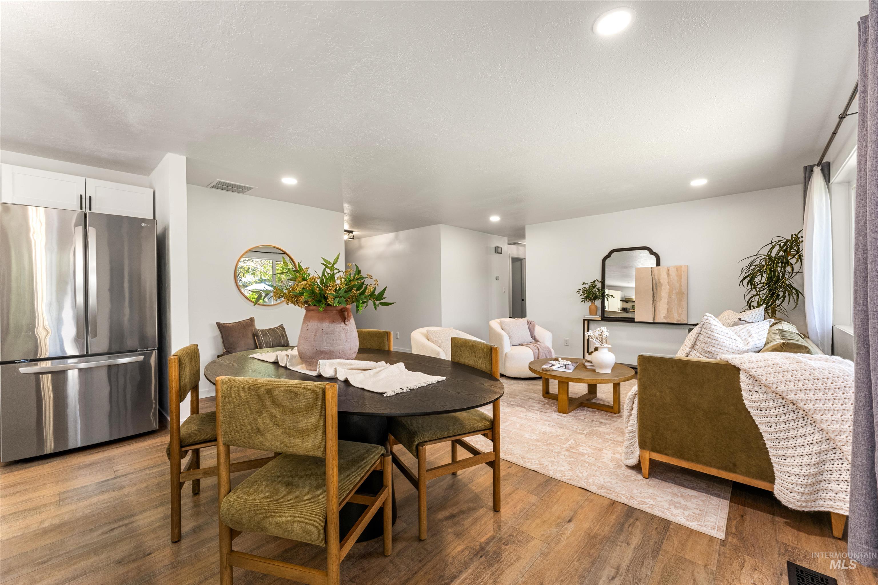 4700 Jennifer Street Boise, ID 83704 - Photo 14 of 39 Open-concept living space featuring wood-finish flooring, recessed lighting, and white walls