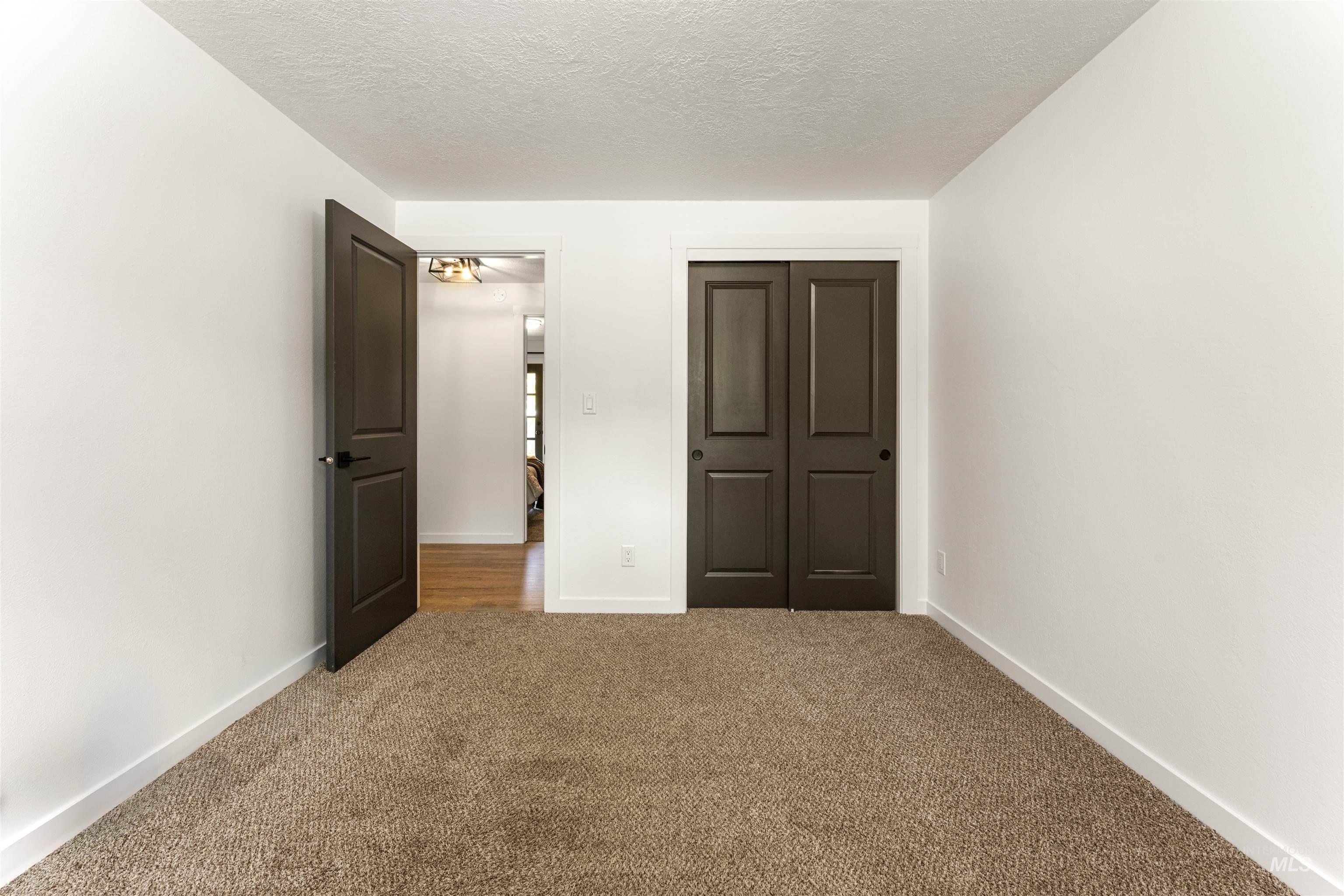 4700 Jennifer Street Boise, ID 83704 - Photo 28 of 39 Neutral color palette with textured carpeting and white walls