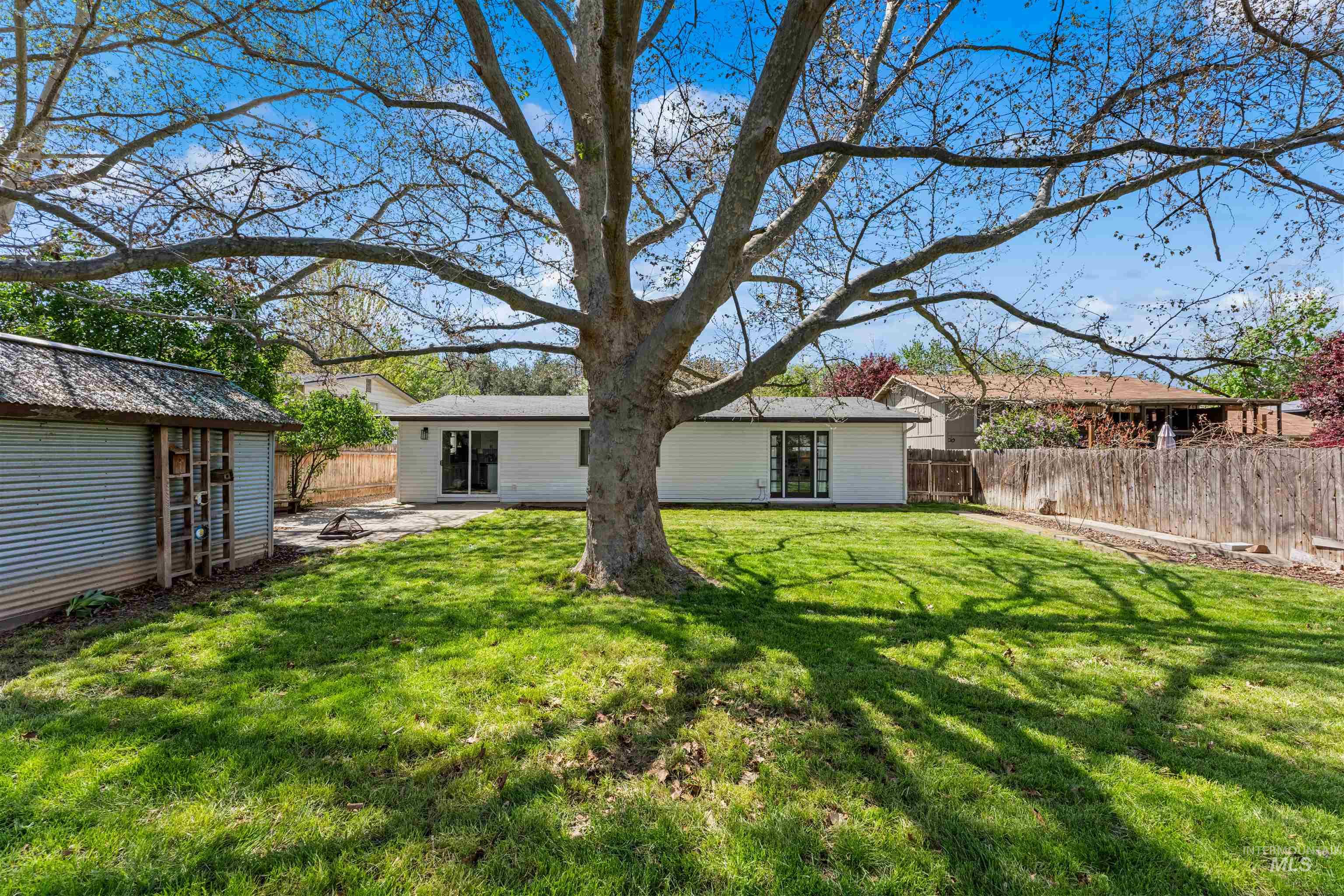 4700 Jennifer Street Boise, ID 83704 - Photo 36 of 39 Expansive grassy lawn with a mature tree