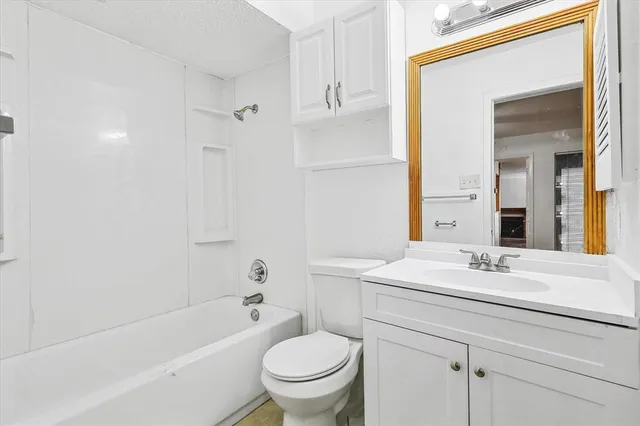 a bathroom with a sink a toilet and a bathtub