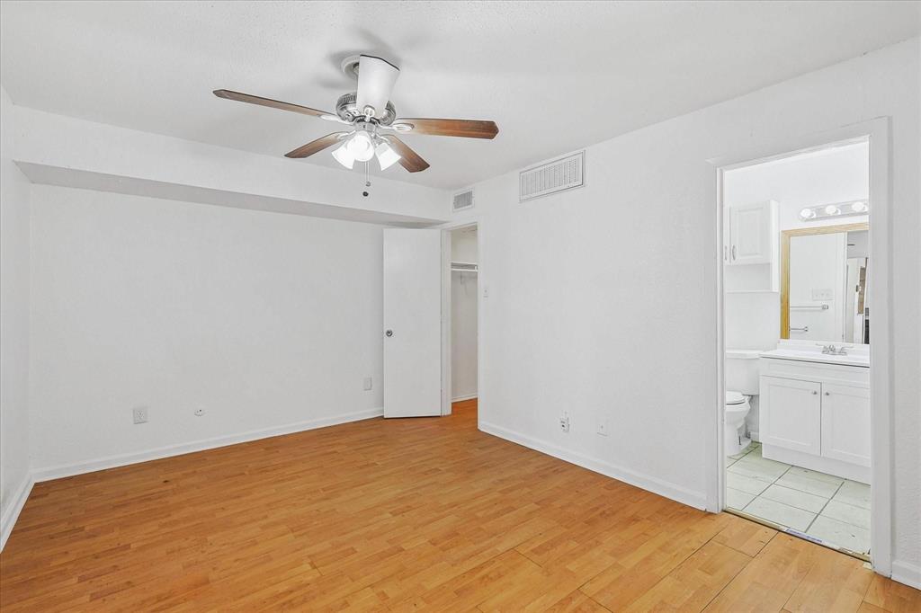 9821 Walnut Street, Unit 101 Dallas, TX 75243 - Photo 8 of 17 a view of an empty room