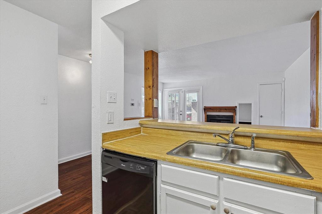 9821 Walnut Street, Unit 101 Dallas, TX 75243 - Photo 10 of 17 a view of a sink and a microwave