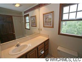 190 Kings Grant Road, Unit 211 Rutherfordton, NC 28139 - Photo 9 of 12 a bathroom with a sink and a mirror
