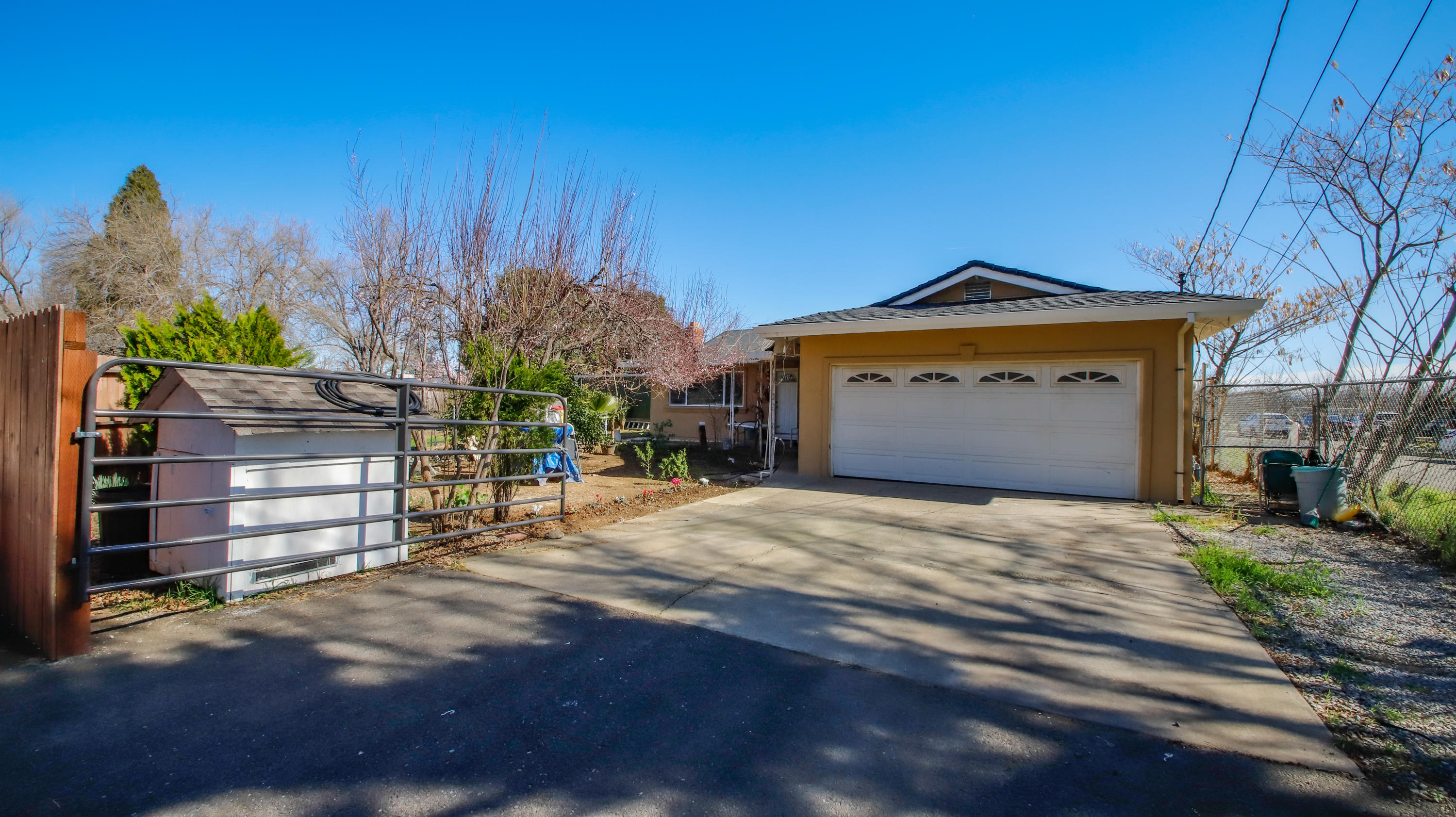 7441 Pacheco Road Redding, CA 96002 - Photo 1 of 19 a front view of a house with a garage
