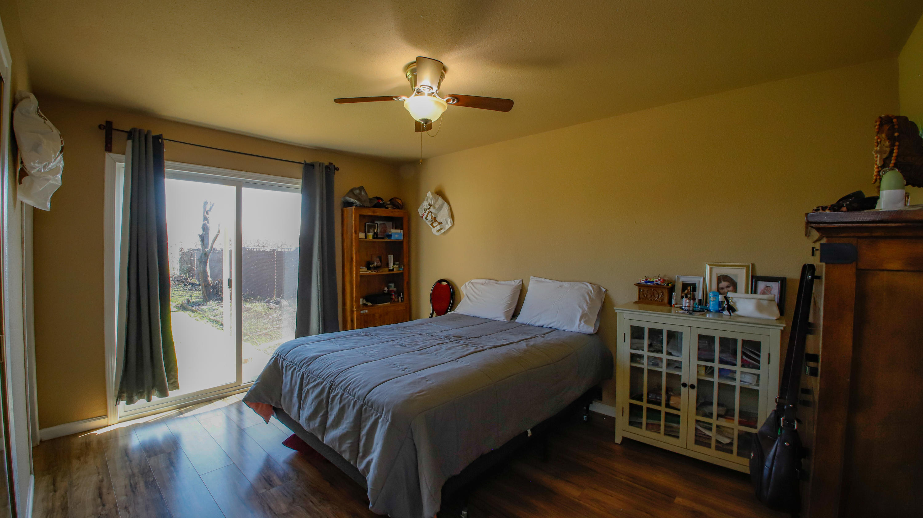 7441 Pacheco Road Redding, CA 96002 - Photo 11 of 19 a bedroom with a bed and a chandelier