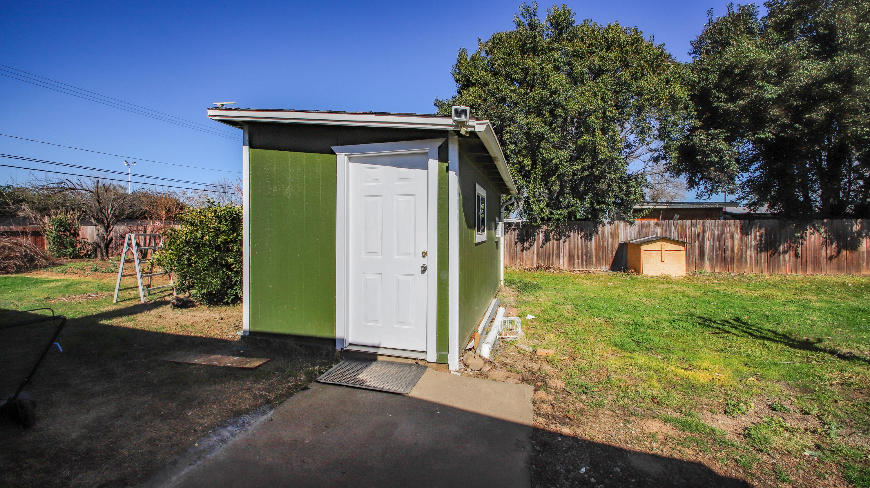 7441 Pacheco Road Redding, CA 96002 - Photo 13 of 19 a front view of a house with garden