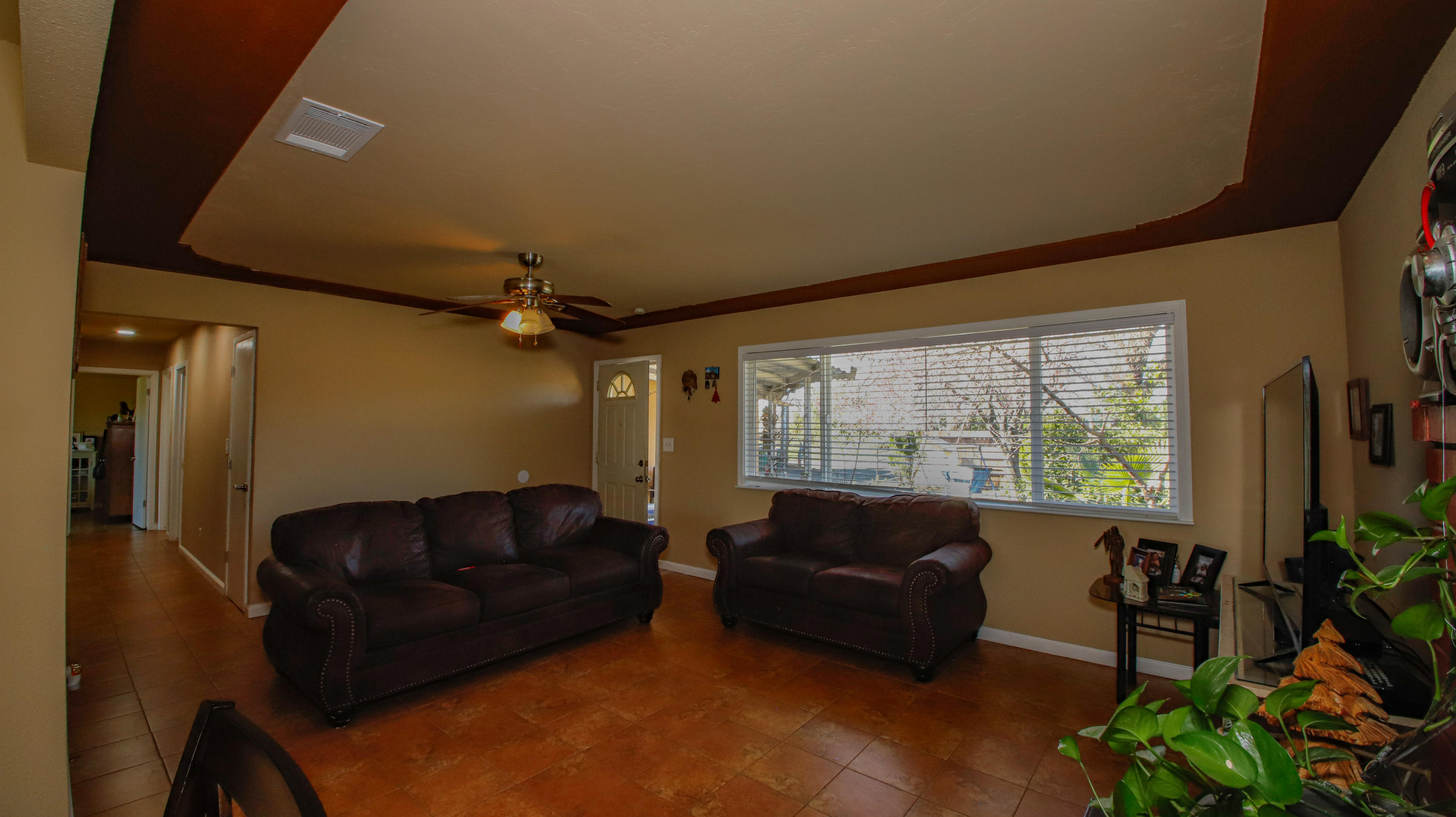 7441 Pacheco Road Redding, CA 96002 - Photo 3 of 19 a living room with furniture and a flat screen tv