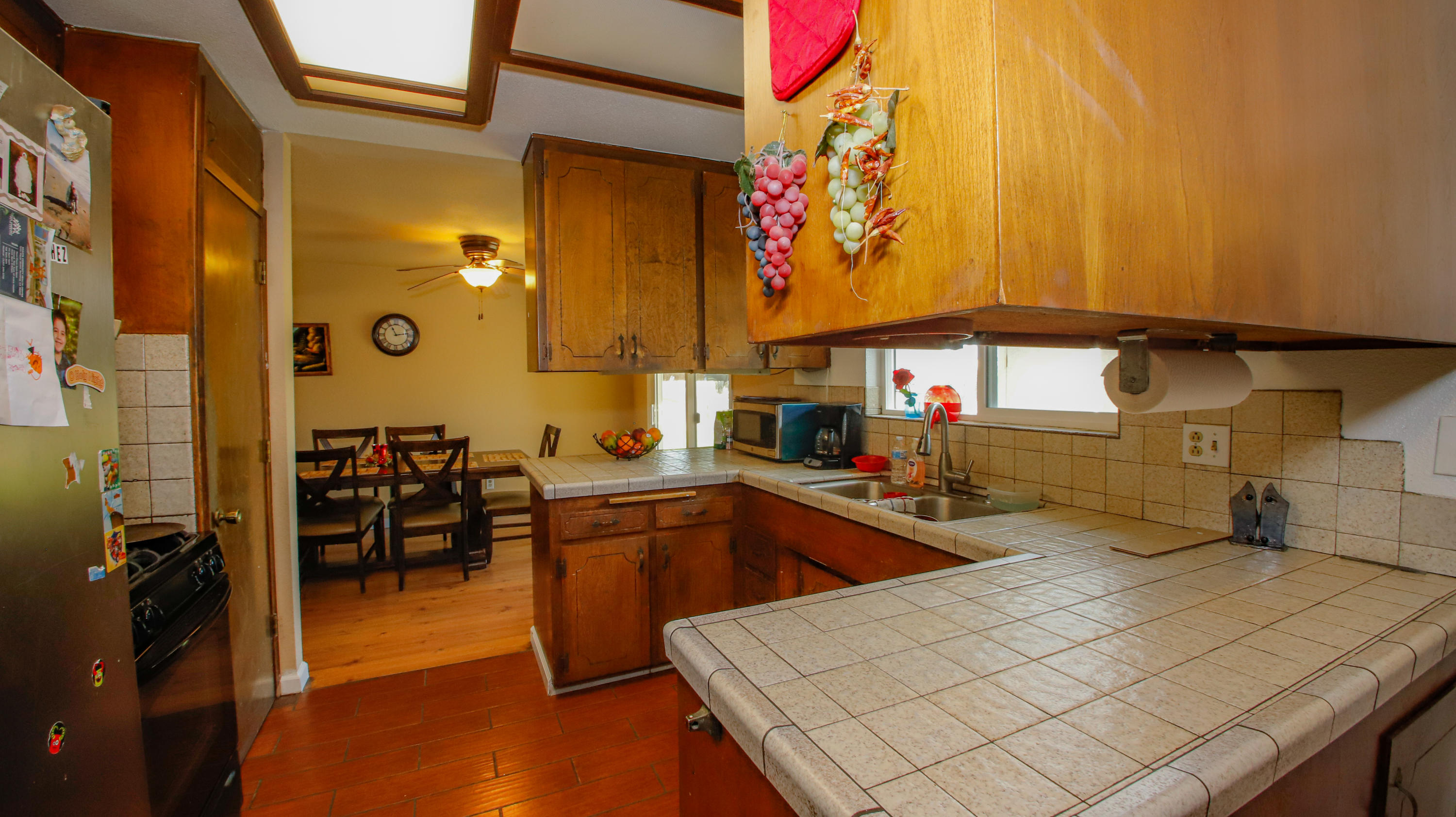 7441 Pacheco Road Redding, CA 96002 - Photo 6 of 19 a kitchen with stainless steel appliances kitchen island granite countertop a sink and cabinets