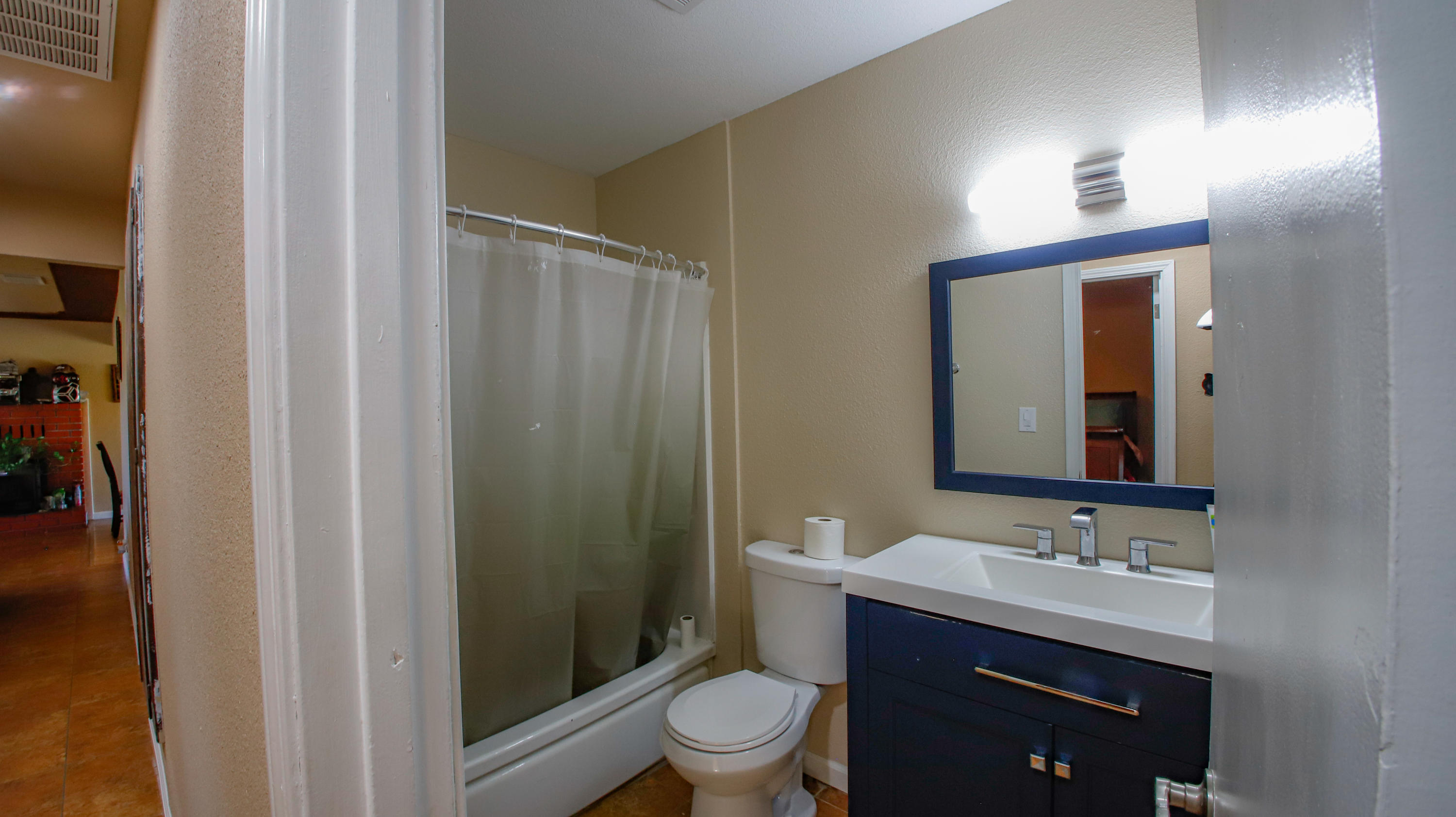 7441 Pacheco Road Redding, CA 96002 - Photo 8 of 19 a bathroom with a sink a toilet a mirror and shower