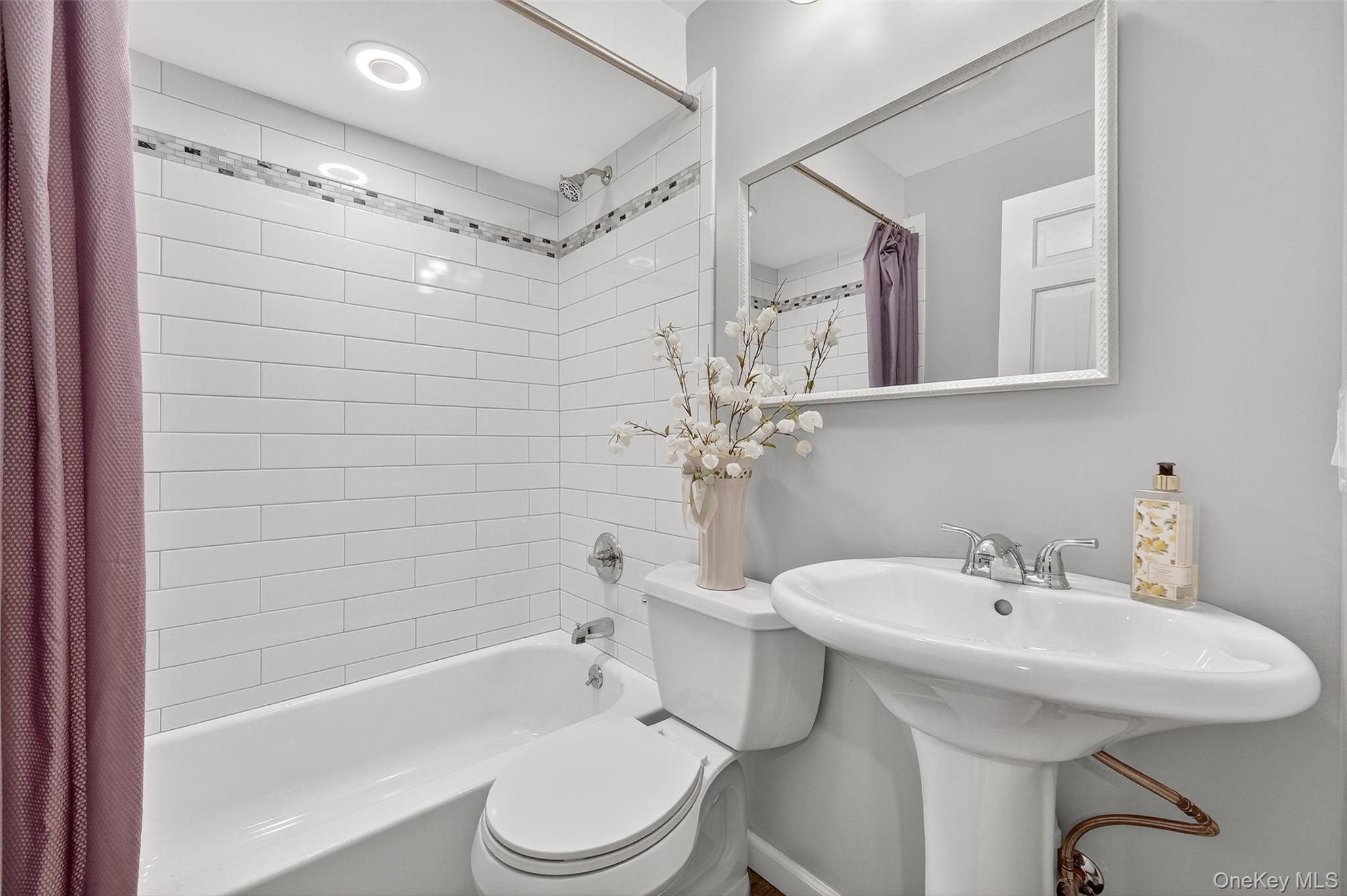 3 Crosshill Road Mahopac, NY 10541 - Photo 16 of 39 a bathroom with a sink a toilet and shower