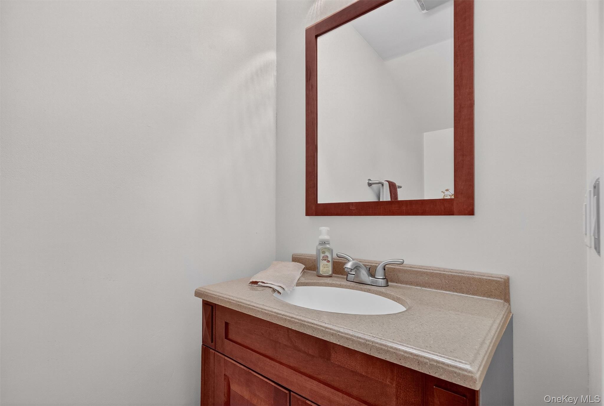 3 Crosshill Road Mahopac, NY 10541 - Photo 33 of 39 a bathroom with a sink and a mirror