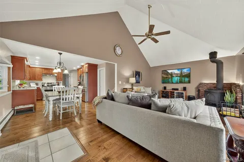 a living room with lots of furniture and a chandelier