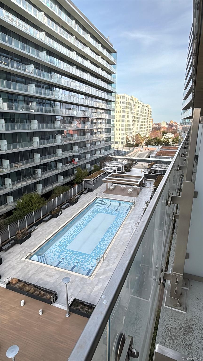 131-03 40 Road, Unit 15L Queens, NY 11354 - Photo 11 of 11 a view of a living room and kitchen