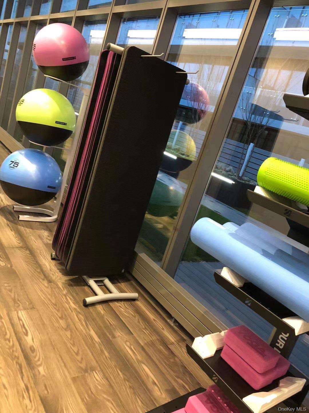 131-03 40 Road, Unit 15L Queens, NY 11354 - Photo 10 of 11 a view of a room with wooden floor