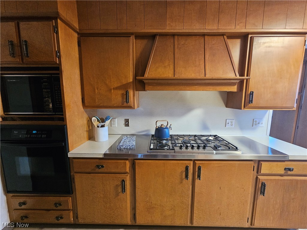 3700 Jaeger Road Lorain, OH 44053 - Photo 10 of 50 Kitchen featuring black appliances and custom range hood