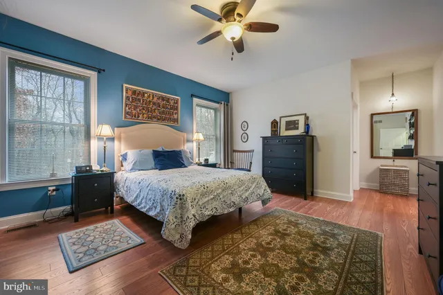 a bedroom with a bed and a couch