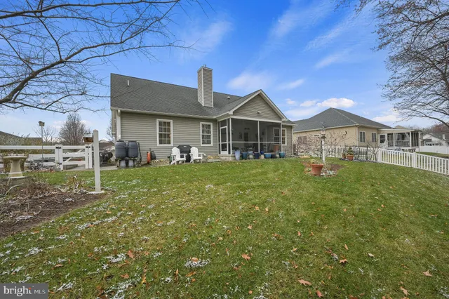 a view of a roof deck with wooden fence