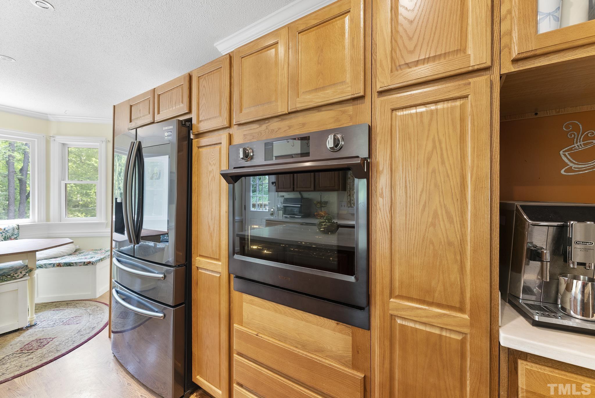 11416 Hickory Grove Church Road Raleigh, NC 27613 - Photo 8 of 40 a kitchen with stainless steel appliances granite countertop a refrigerator and a sink