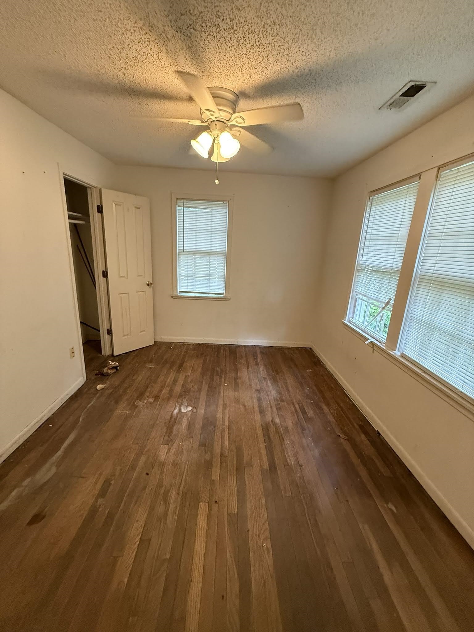 8488 Quito Road Millington, TN 38053 - Photo 16 of 30 a view of empty room with wooden floor and fan